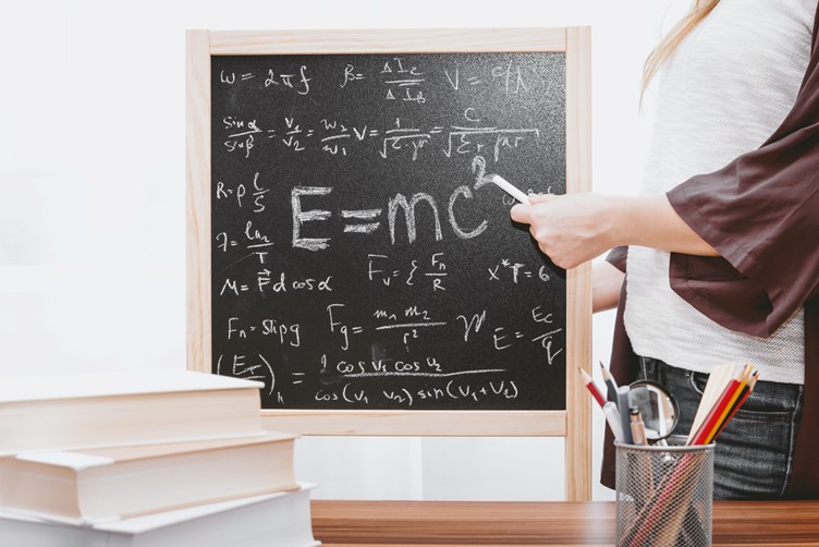 Maths being performed on a black board